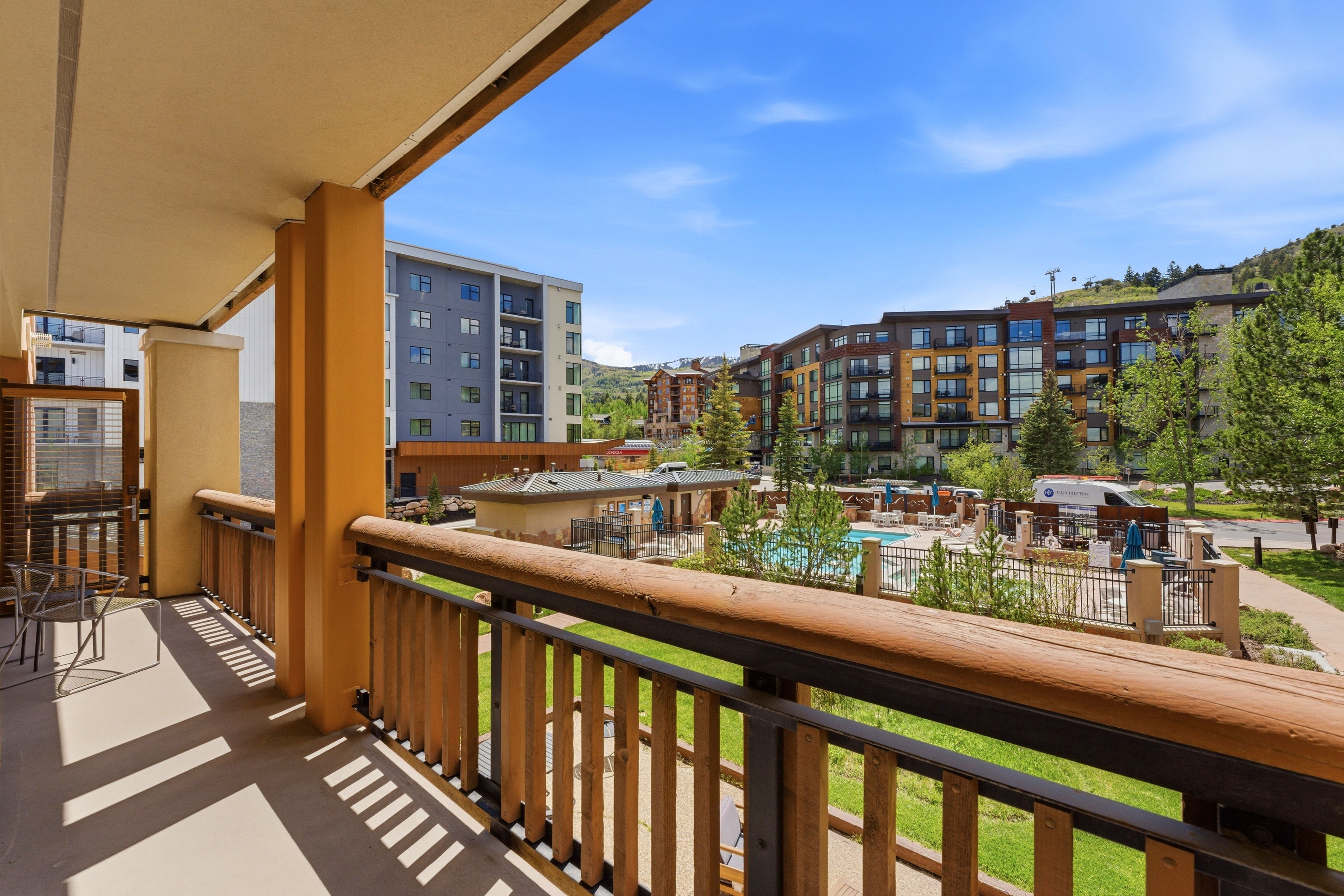 Private balcony featuring a wood railing