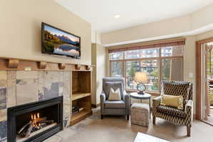 Tile-surround fireplace with a wood mantle and built-in shelving