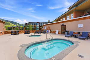 Outdoor patio area featuring two built-in spas with tiled interiors