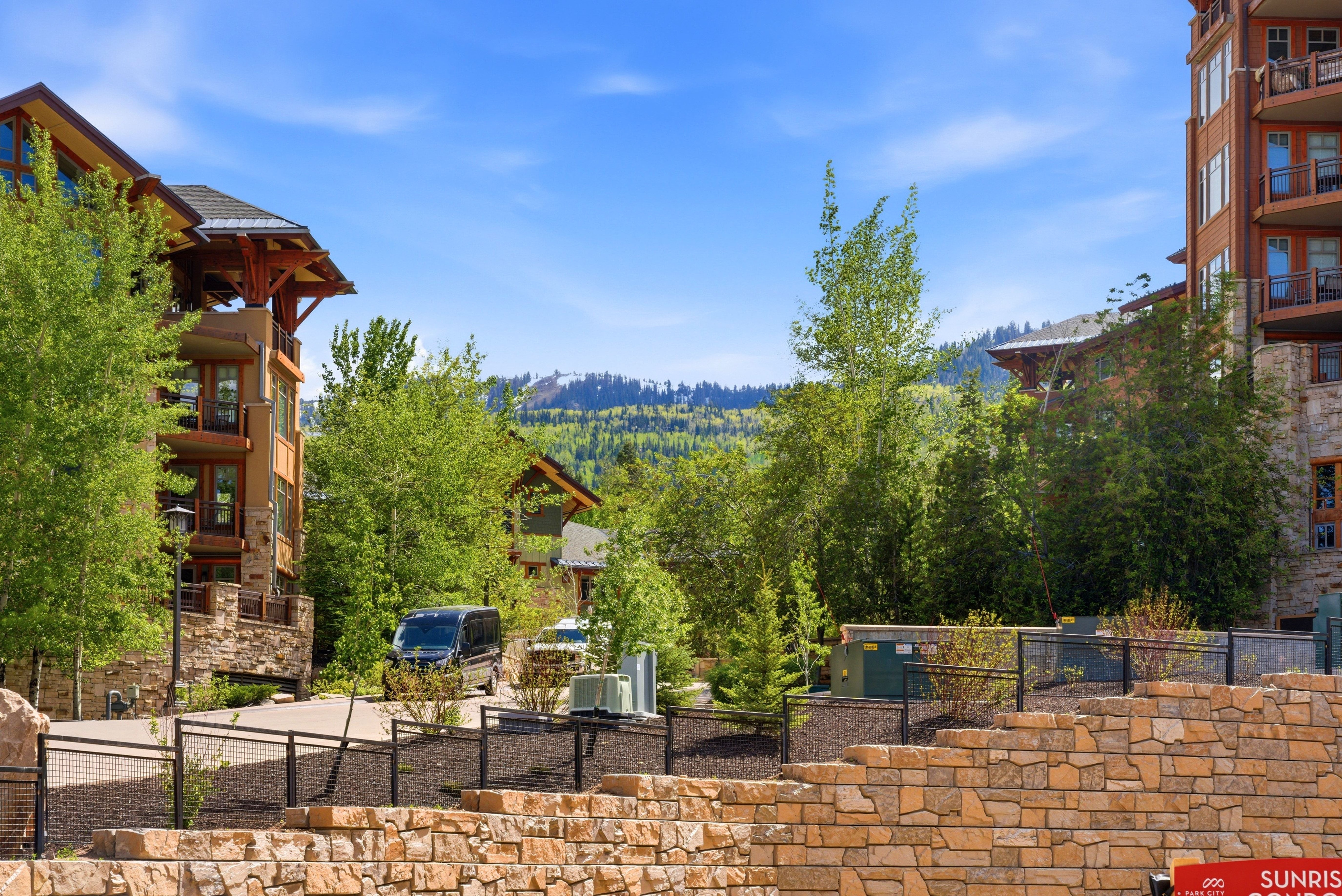 Multi-story building featuring stone and wood accents