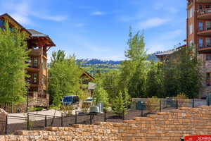 Multi-story building featuring stone and wood accents