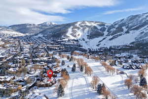 Aerial perspective showcasing a snow-covered mountainous region