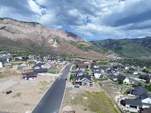 Residential community nestled at the base of a prominent mountain range