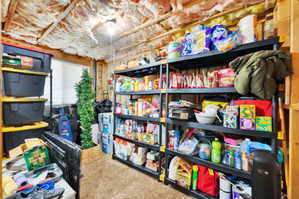 Utility space with exposed ceiling joists and insulation