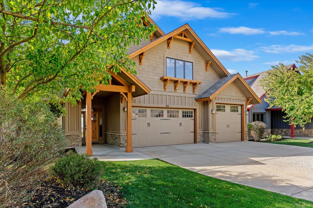 Craftsman-style facade featuring earth-toned siding and stone accents