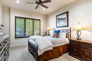 Recessed lighting illuminates neutral-toned walls and plush carpet flooring