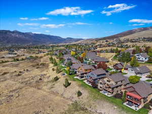 Expansive mountain and valley scenery provides a dramatic backdrop to a residential community