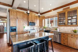 Kitchen featuring wood-finish flooring and exposed wood ceiling beams