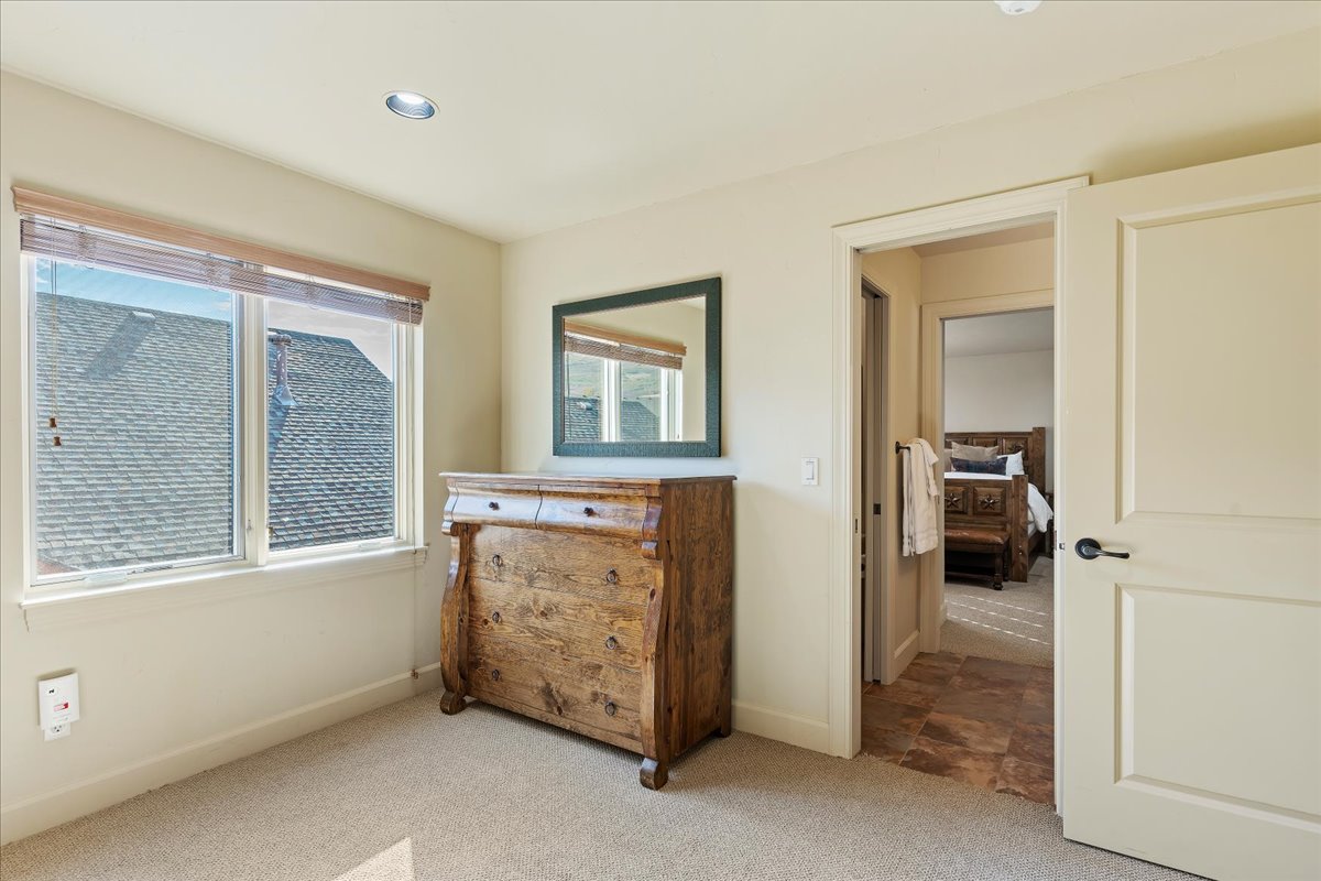 Neutral wall paint complemented by recessed ceiling lighting