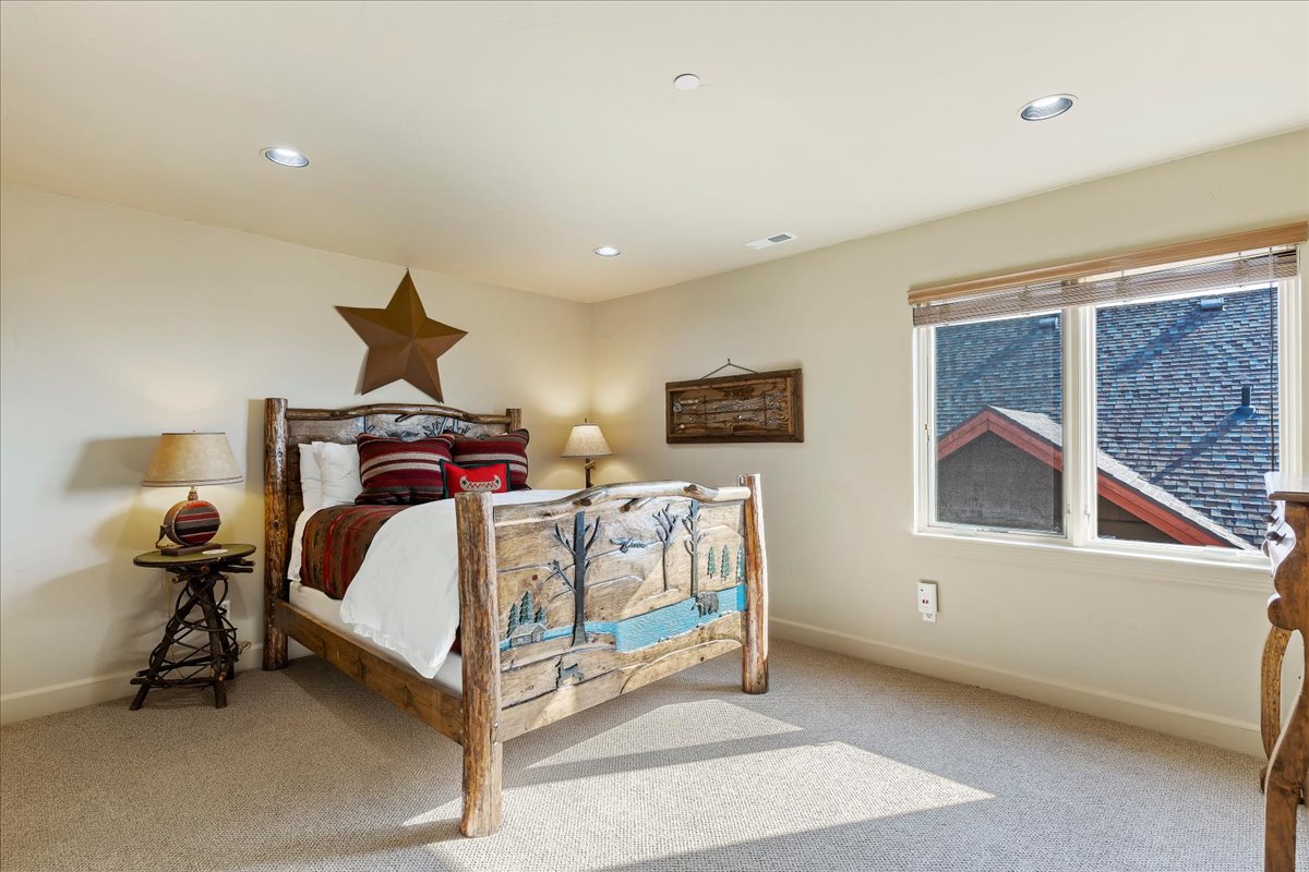 Carpeted room featuring recessed lighting and a window with wood blinds