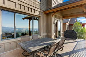 Expansive patio featuring a stamped concrete surface, a covered outdoor area, and large sliding glass doors