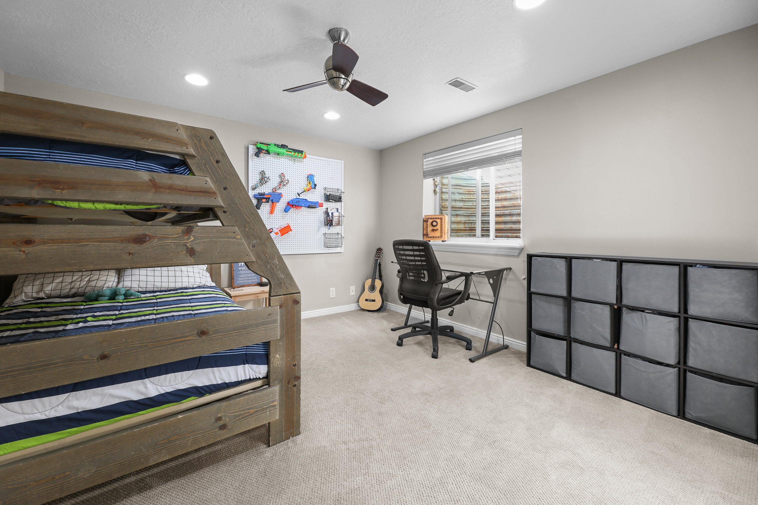 Spacious room featuring neutral carpeting, recessed lighting, and a ceiling fan