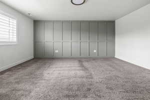 Primary Bedroom. Accent wall featuring board and batten paneling
