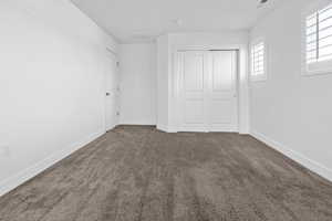 Bedroom 2 Plush carpeting and bright white walls create a neutral backdrop