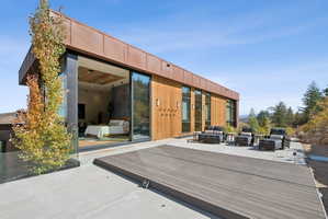 Deck with an outdoor hangout area and a patio area