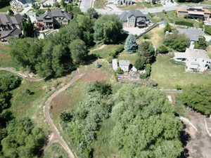 Expansive grounds featuring natural landscaping and mature trees