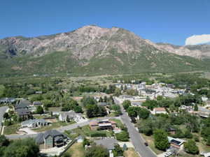 Expansive mountain range backdrop framing a residential neighborhood