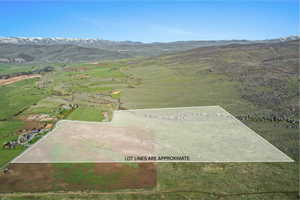 Expansive raw land parcel featuring varied terrain, including flat and sloped areas