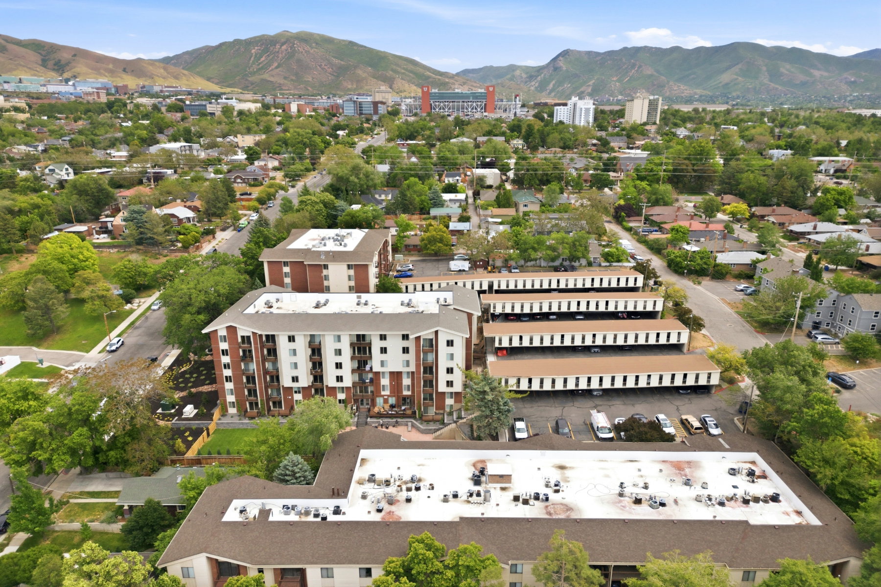 Aerial perspective showcasing multi-story residential buildings with brick and white facades