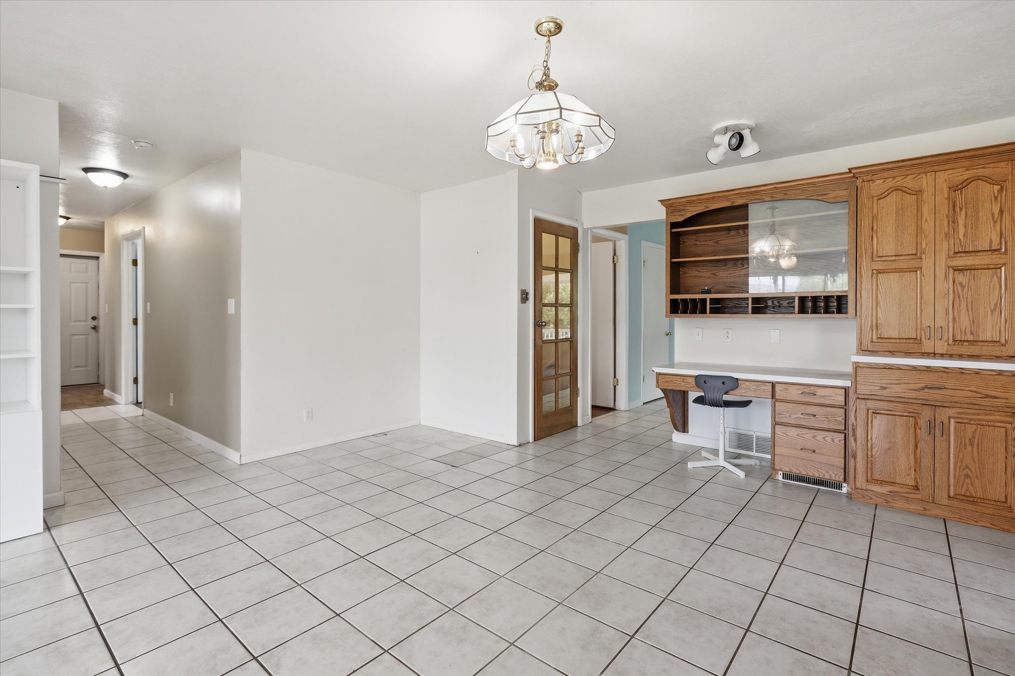 Spacious interior featuring light-colored tile flooring throughout