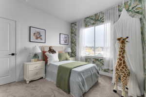 Bedroom featuring a single window with sheer white curtains, a white paneled door with a black handle, and plush carpet flooring