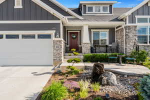 Contemporary gray siding exterior with stone accents