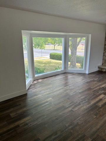 Bay window featuring multiple panes and white trim