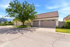 Two-car garage with panel-style doors and upper window inserts