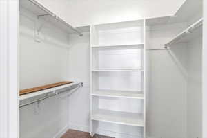 Primary bedroom walk-in closet