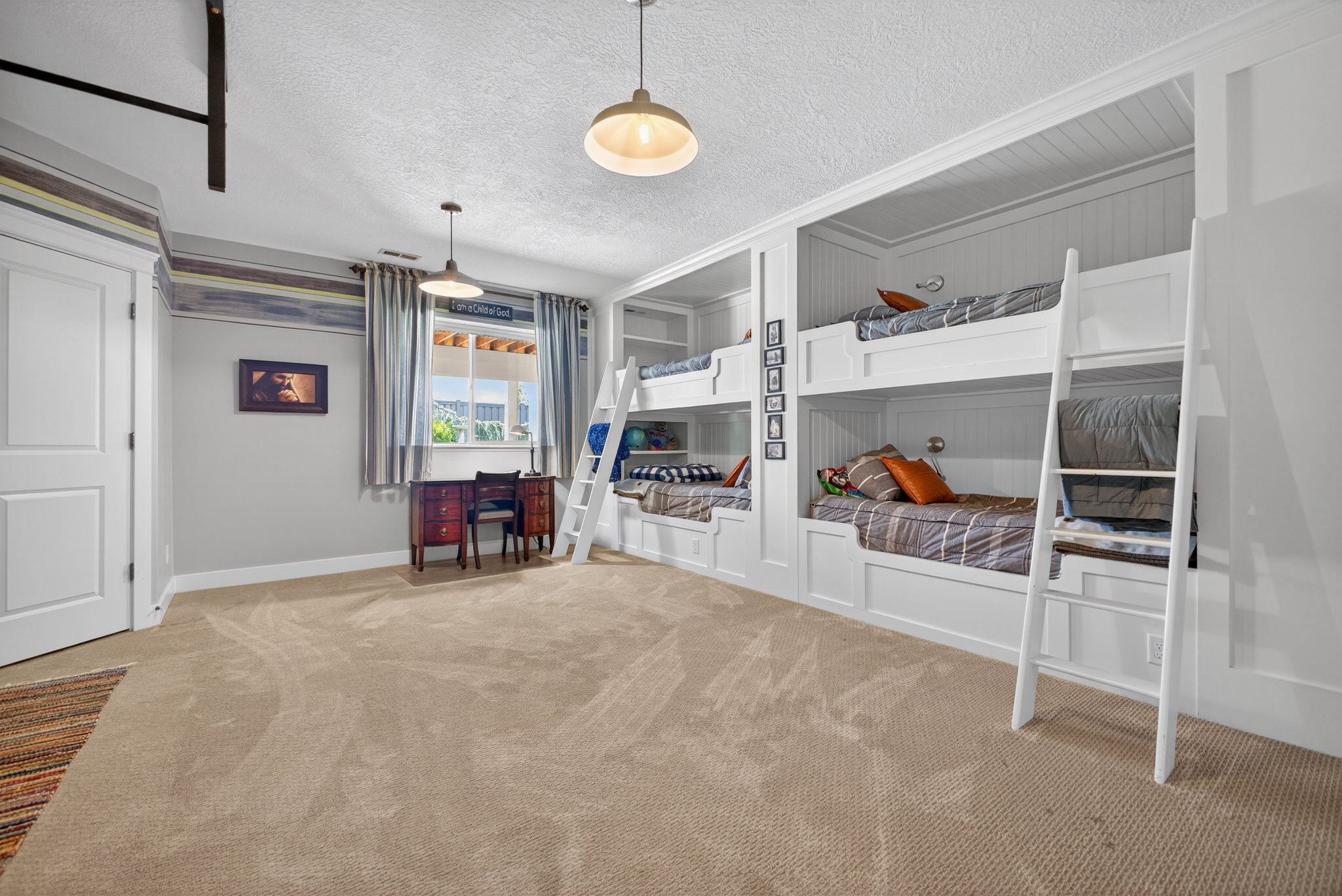 Built-in bunk beds with integrated shelving and wall sconces