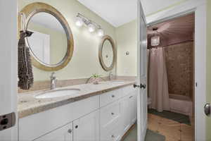Double vanity with granite countertop and two vessel sinks