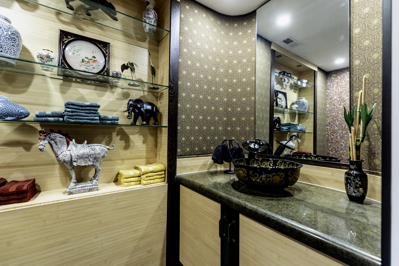 Vanity featuring a decorative vessel sink, stone countertop, and full-wall mirror