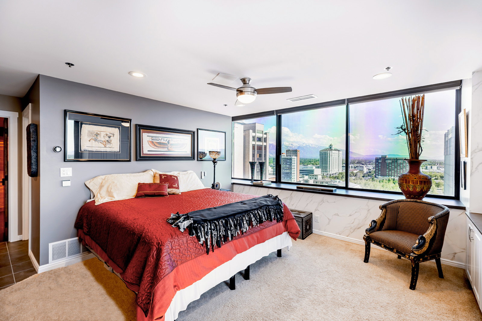 Spacious room featuring floor-to-ceiling windows, recessed lighting, and a ceiling fan