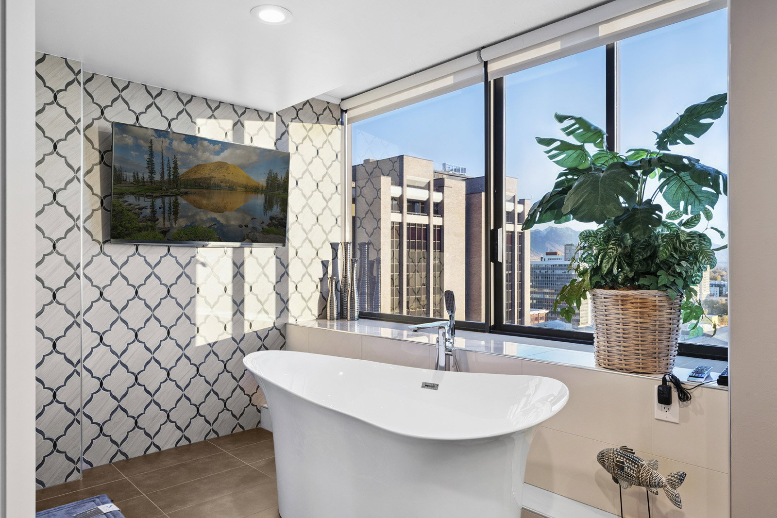 Freestanding soaking tub with floor-mounted faucet