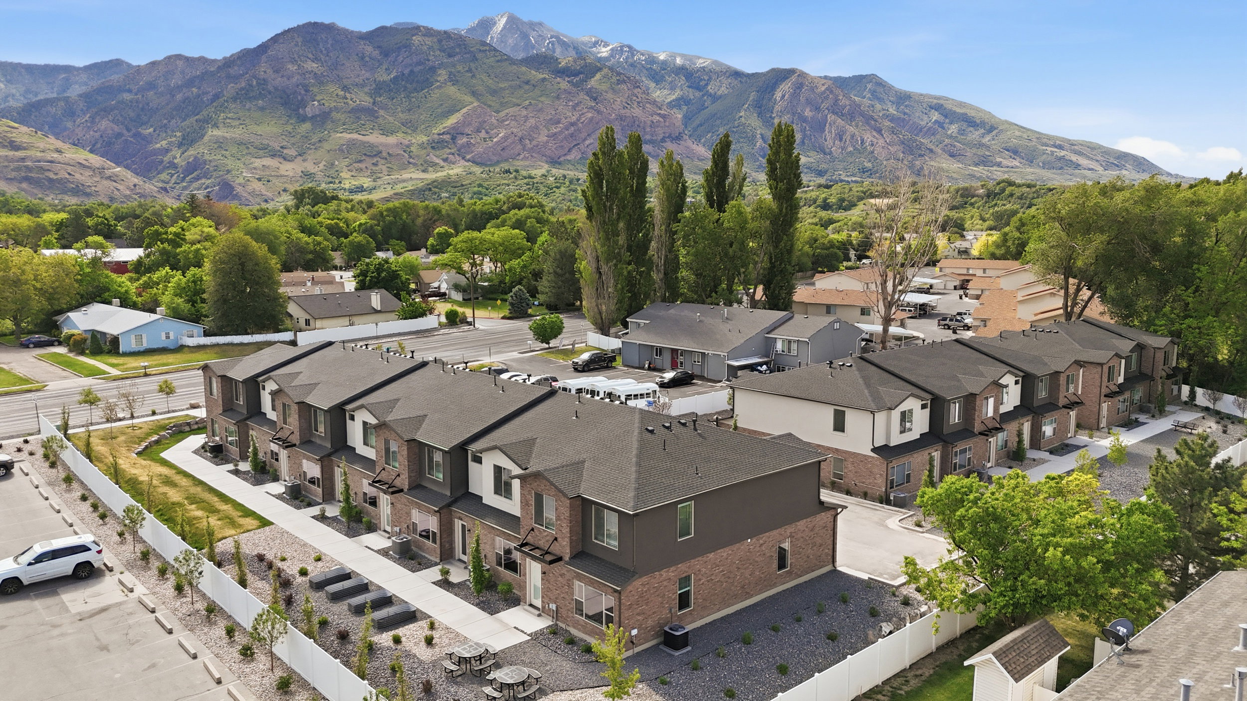 Modern townhome development featuring brick and siding exteriors