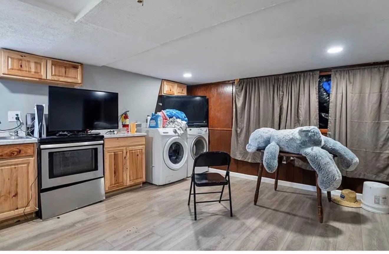 Dedicated laundry area featuring a front-load washer and dryer