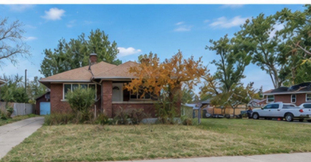 Brick exterior with a gabled roof and white trim