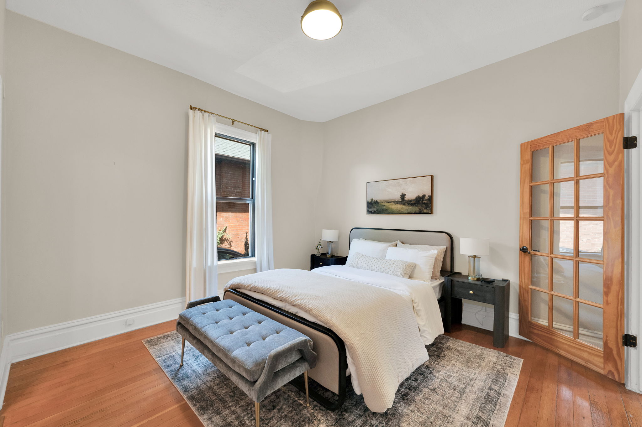 Hardwood flooring paired with light neutral wall tones