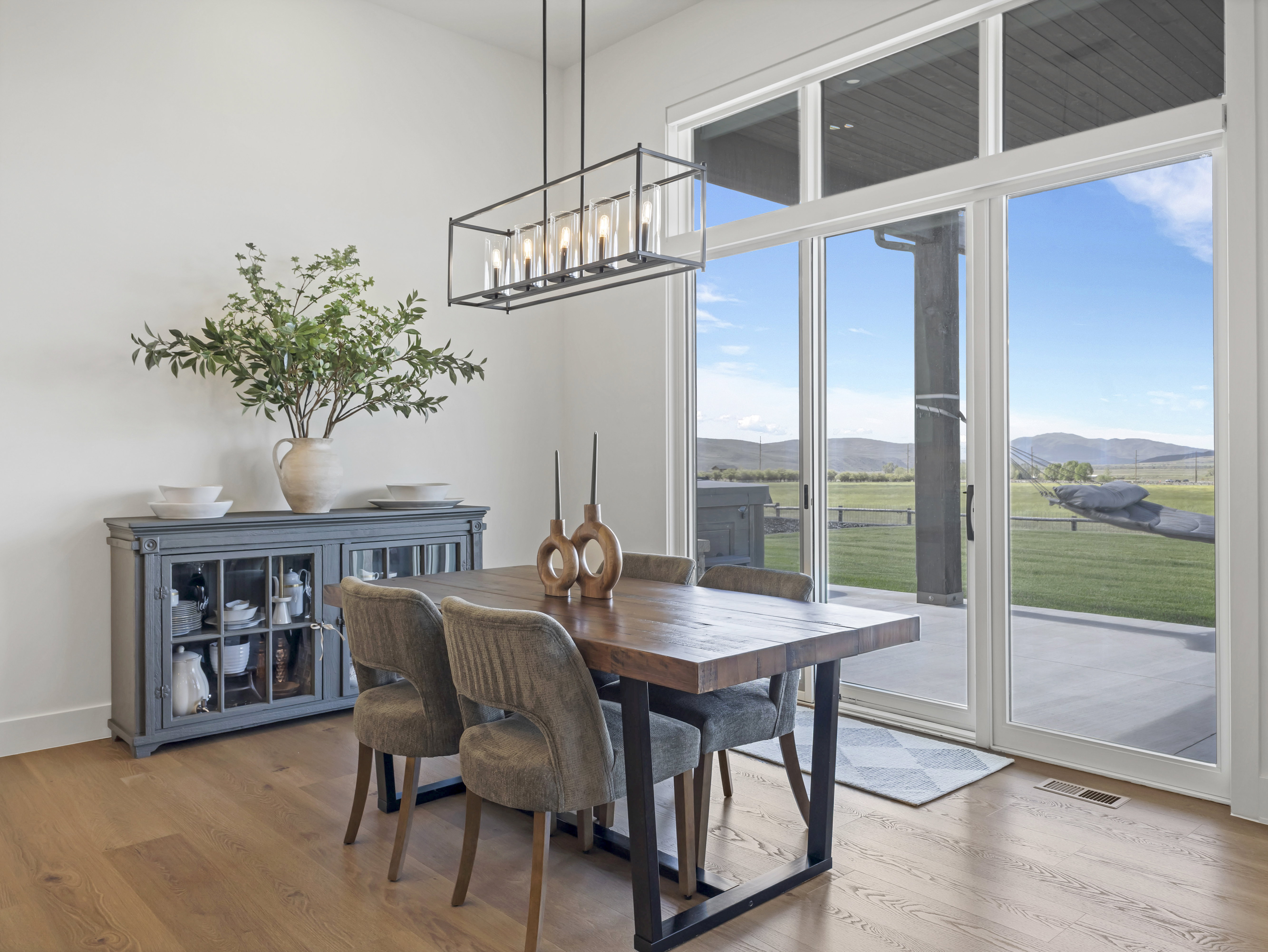 Expansive glass sliding doors open to outdoor space