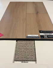 Wood-finish plank flooring sample in a light tone