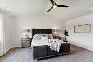 Vaulted ceiling bedroom featuring a contemporary ceiling fan, light gray carpeting, and white walls
