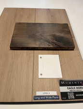 Rigid core flooring in a long and wide plank format, showcasing a light wood-finish with visible grain