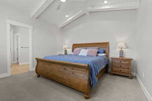 Vaulted ceiling with white shiplap and exposed beams, recessed lighting, and a ceiling fan