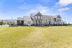 Townhome row with gray siding and stone facade