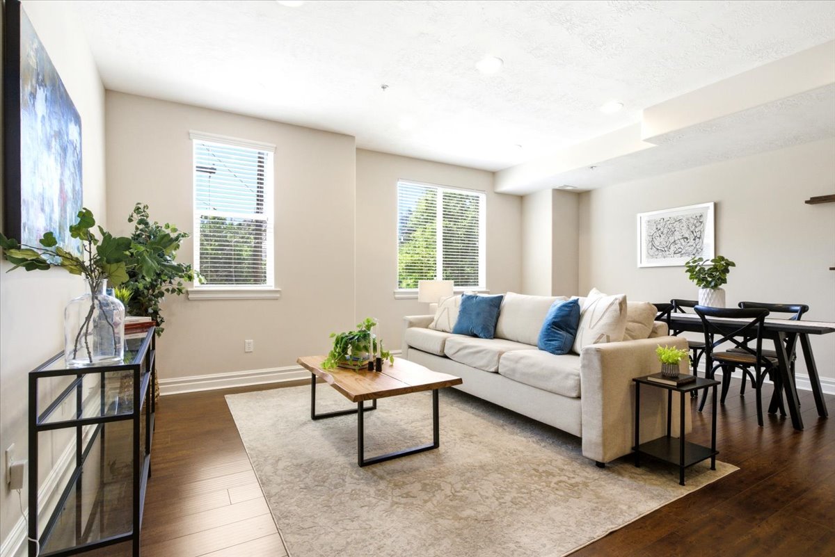 Open-concept living area with dark wood-finish flooring