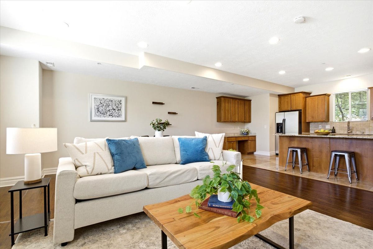 Open-concept living area featuring recessed lighting and light-toned walls