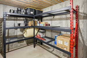 Concrete foundation walls with exposed wood joist ceiling
