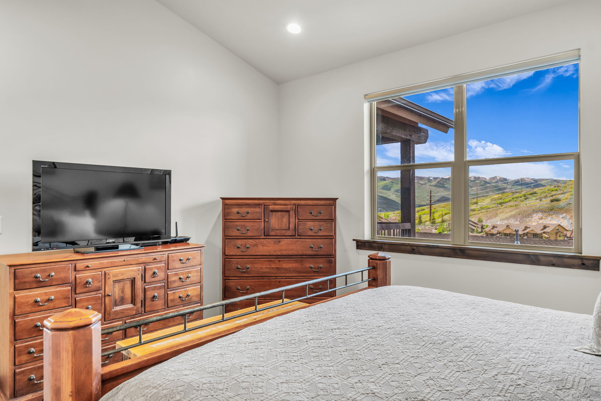 Expansive window overlooking distant mountains and additional properties