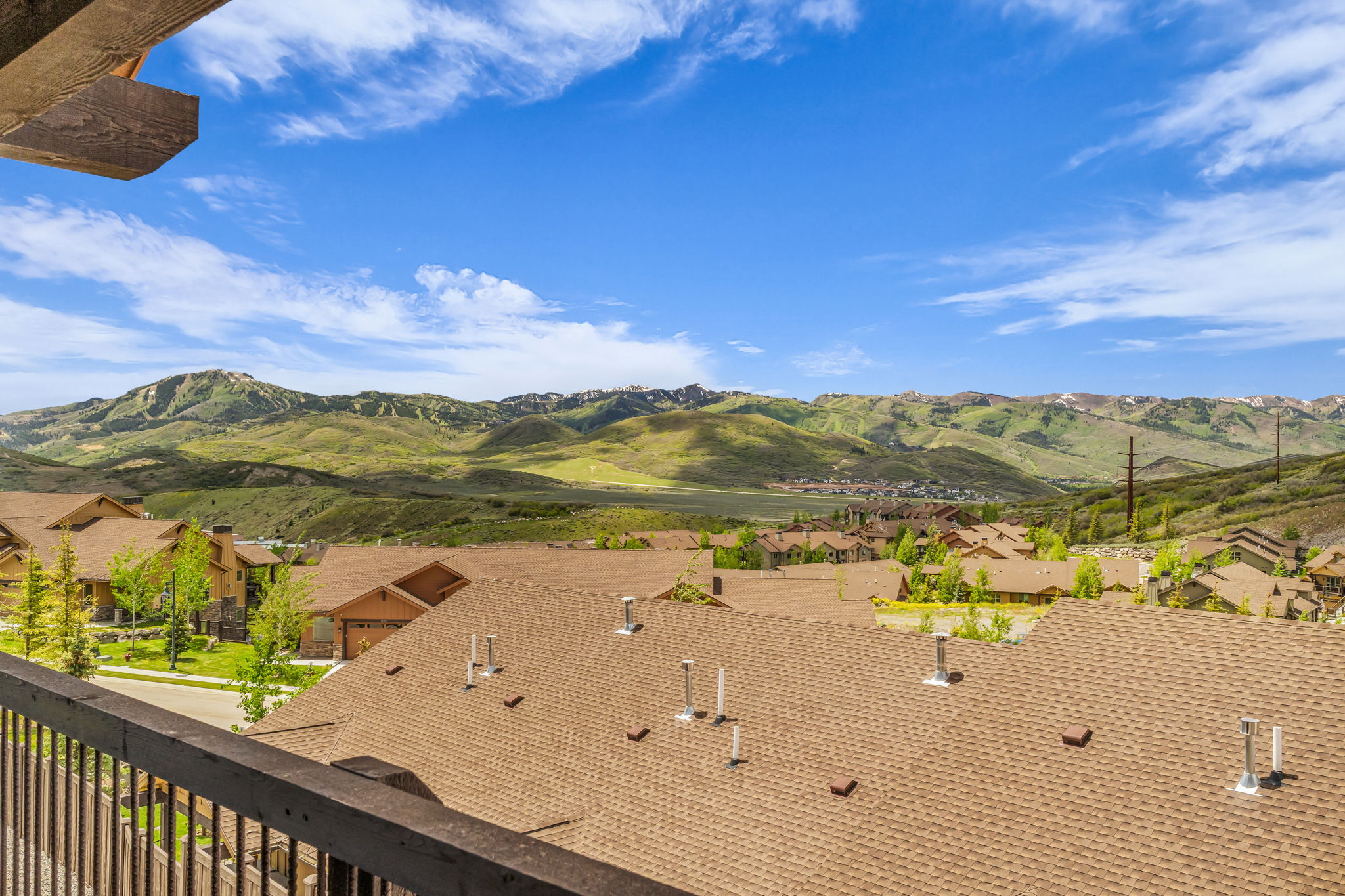 Expansive mountain scenery with a partial residential development