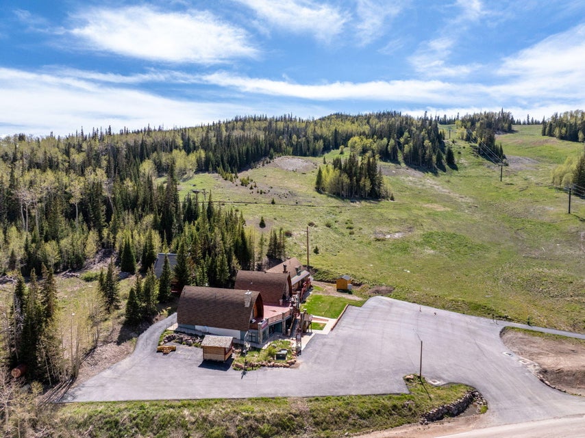 Mountain property featuring multiple structures with distinctive rounded roofs